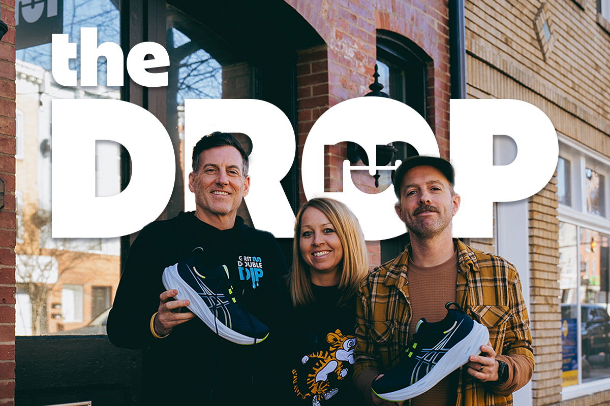 man on left holding shoe woman in center, man on right holding shoe