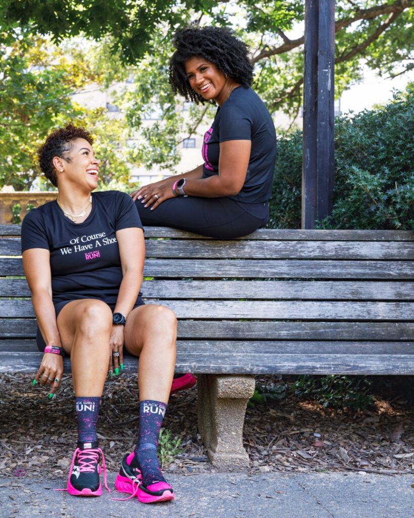 two women sitting on a bench