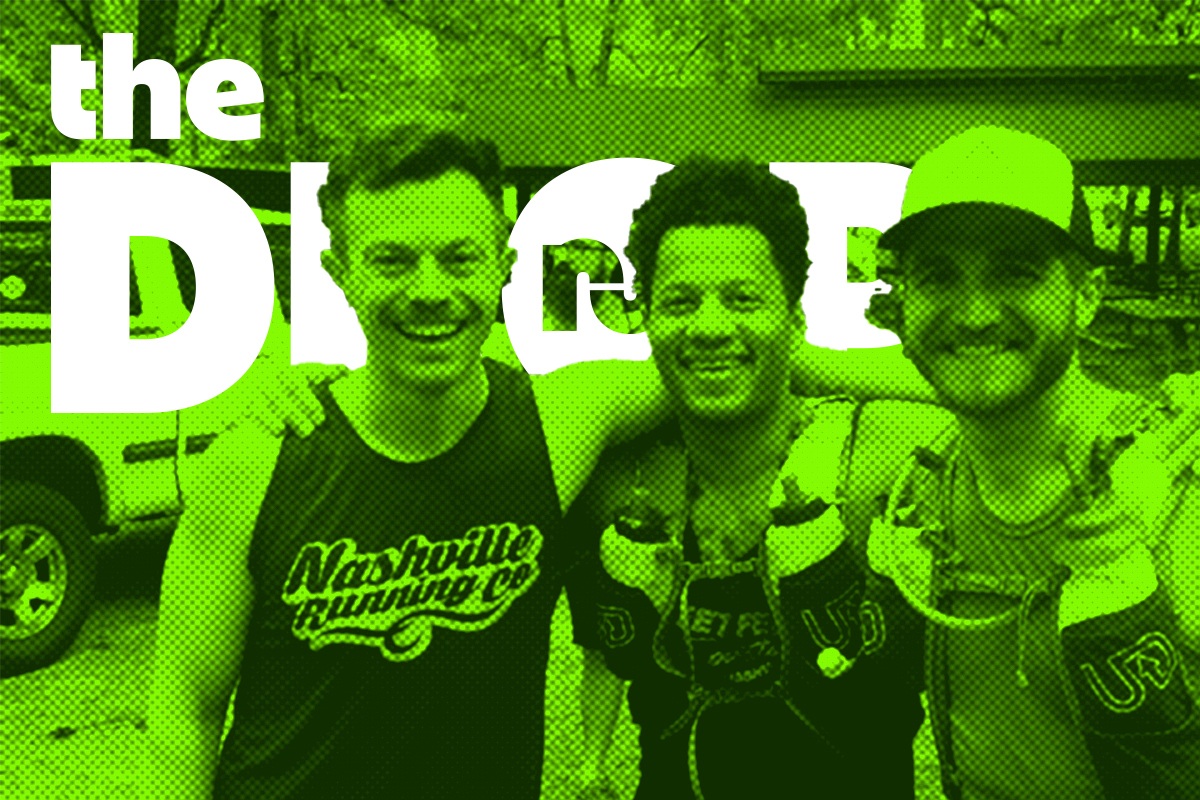 three men smiling in a photo in running gear