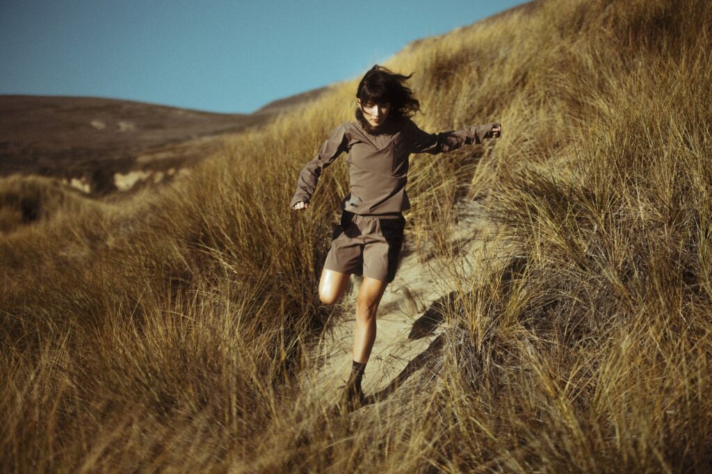 GIRL RUNNING ON TRAILS
