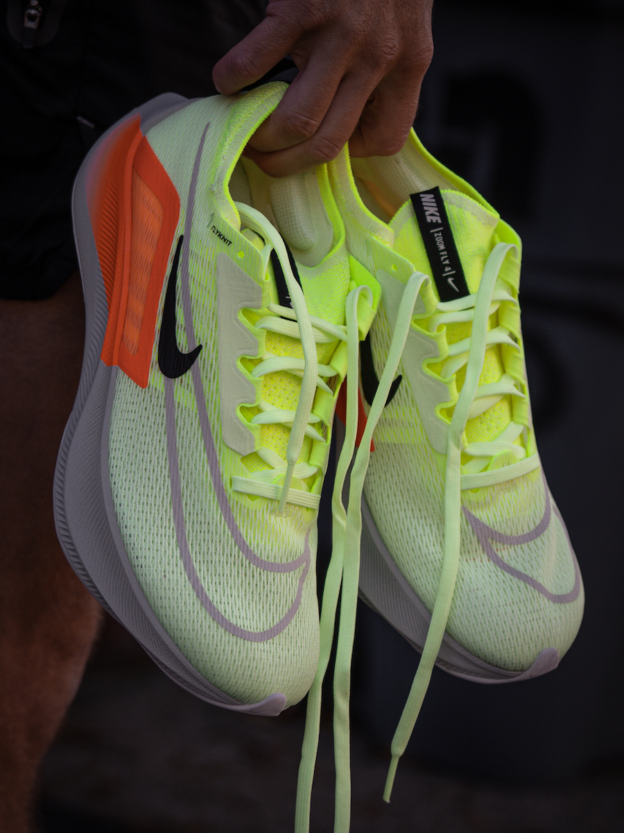 nike zoom fly 4 holding a pair