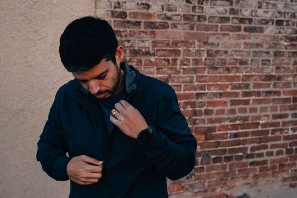 Jarrett wearing the Iffley Road fall waterproof jacket