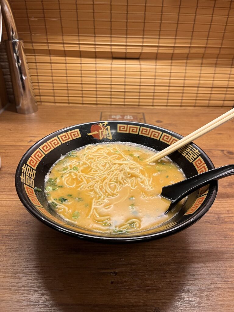 bowl of ramen soup with chopsticks in it