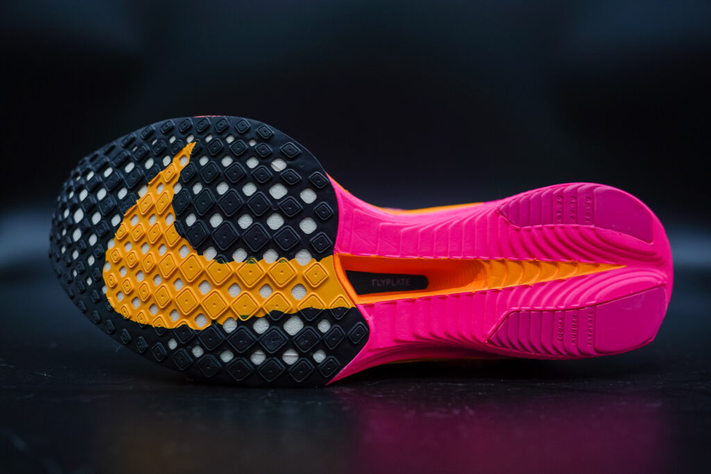 outsole of nike vaporfly 3 with orange nike swoosh