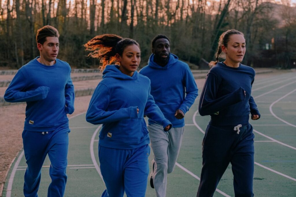 runners running in sweatpants and sweatshirt