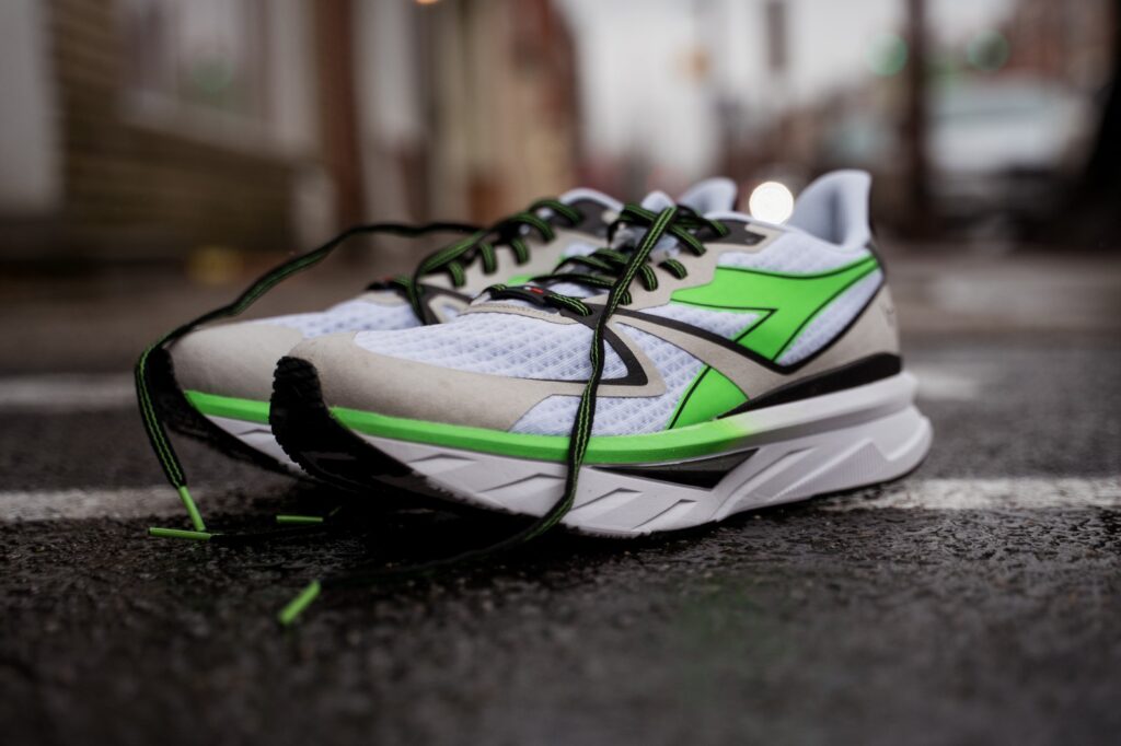 diadora atomo v7000 men's neon green details on city sidewalk