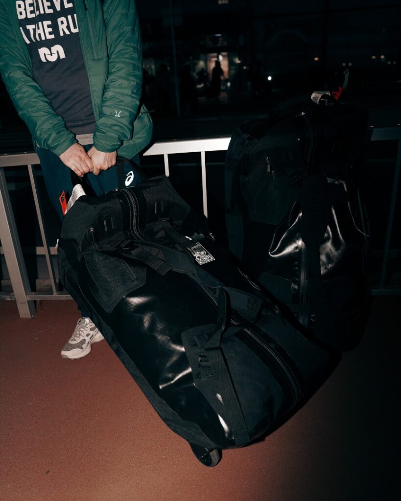 man pulling luggage at an airport