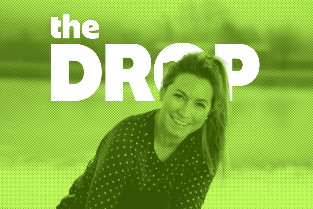 woman smiling with a green background