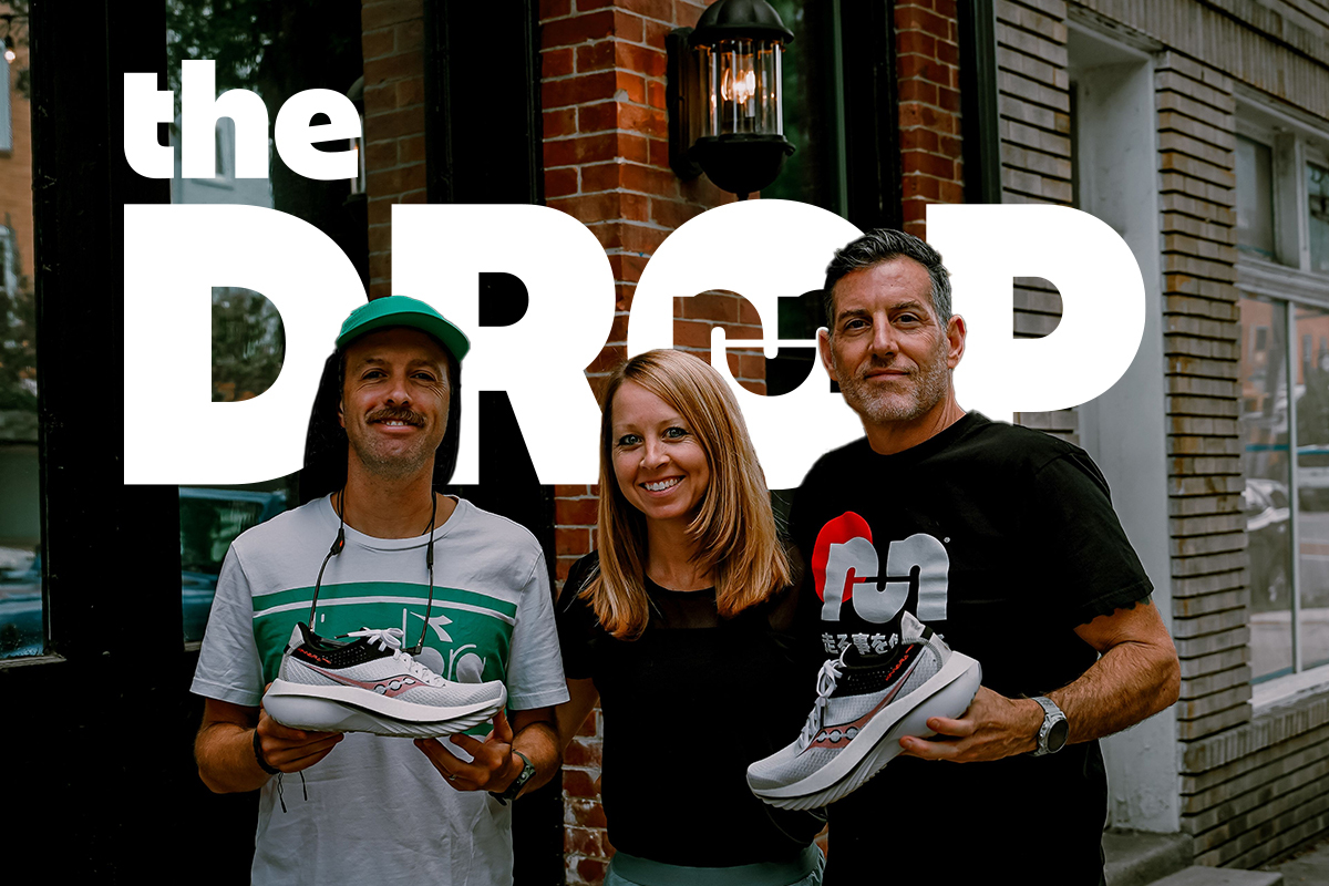 man on left holding shoe woman in middle smiling man on right holding shoe