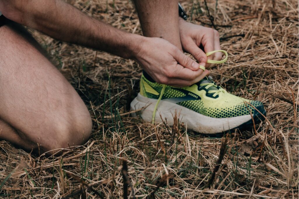 trail running - tying shoe
