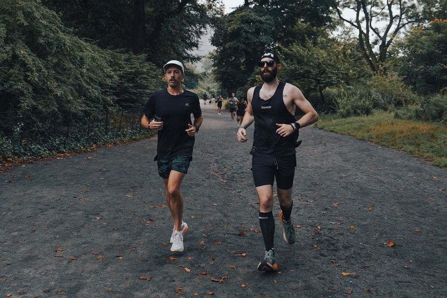 two guys running in central park