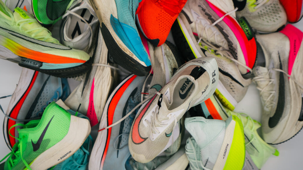 a pile of nike running shoes