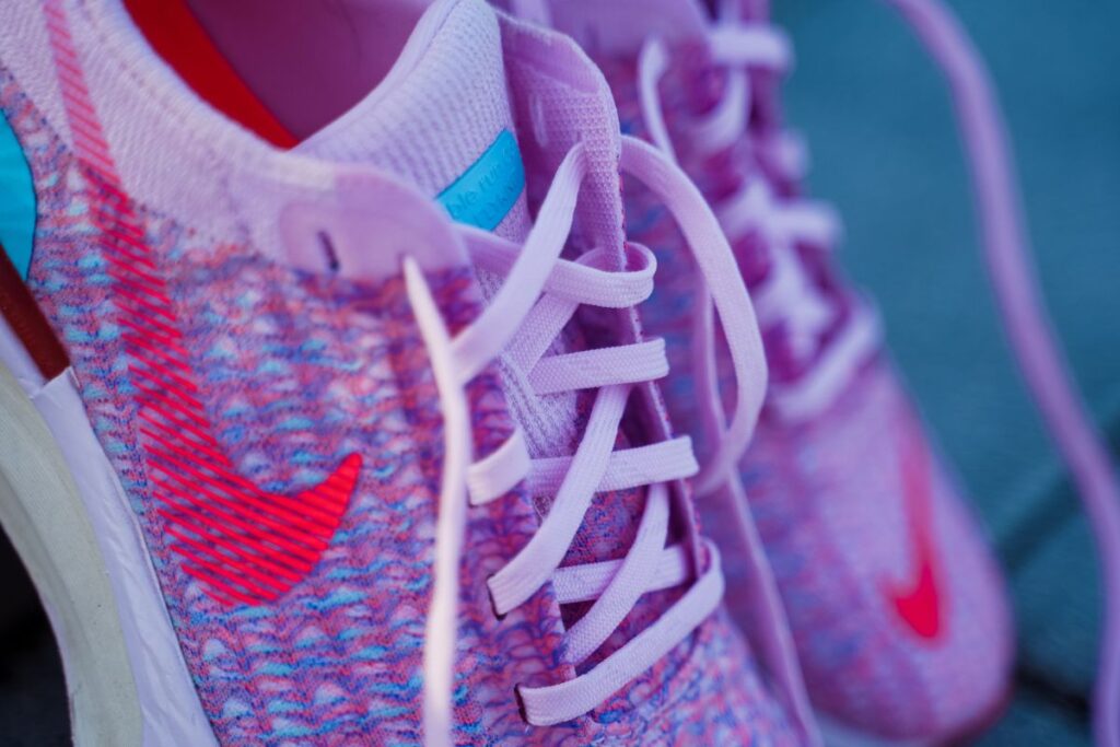 pink nike zoomx invincible 3, closeup of shoelaces