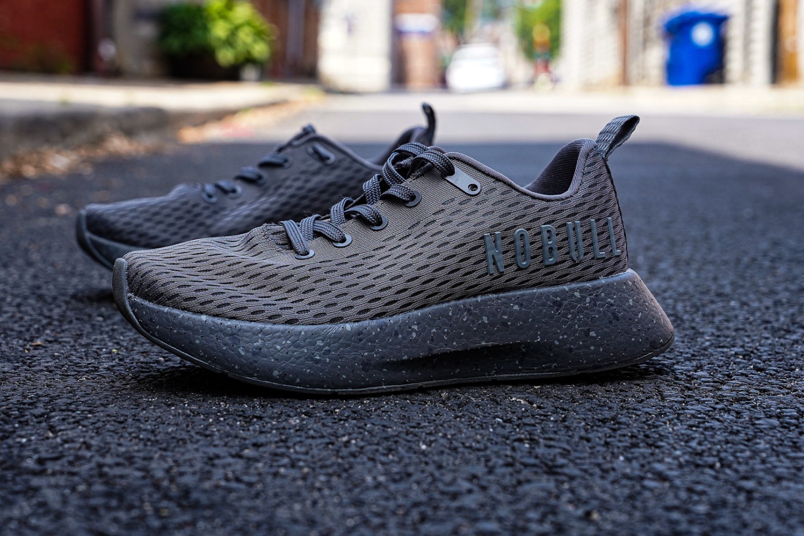 grey nobull runner+ side of the shoe in an alleyway