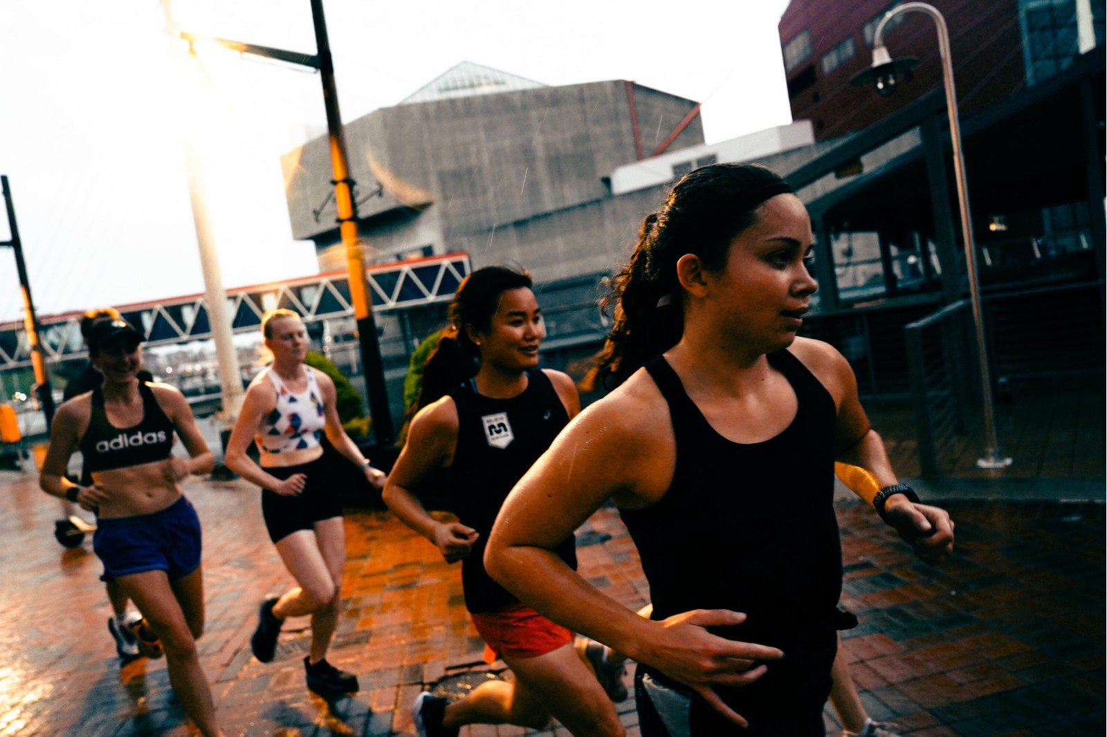 group of women running in a city