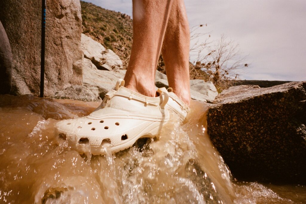 satisfy x crocs classic clog with water coming through it in a waterfall in the arizona desert