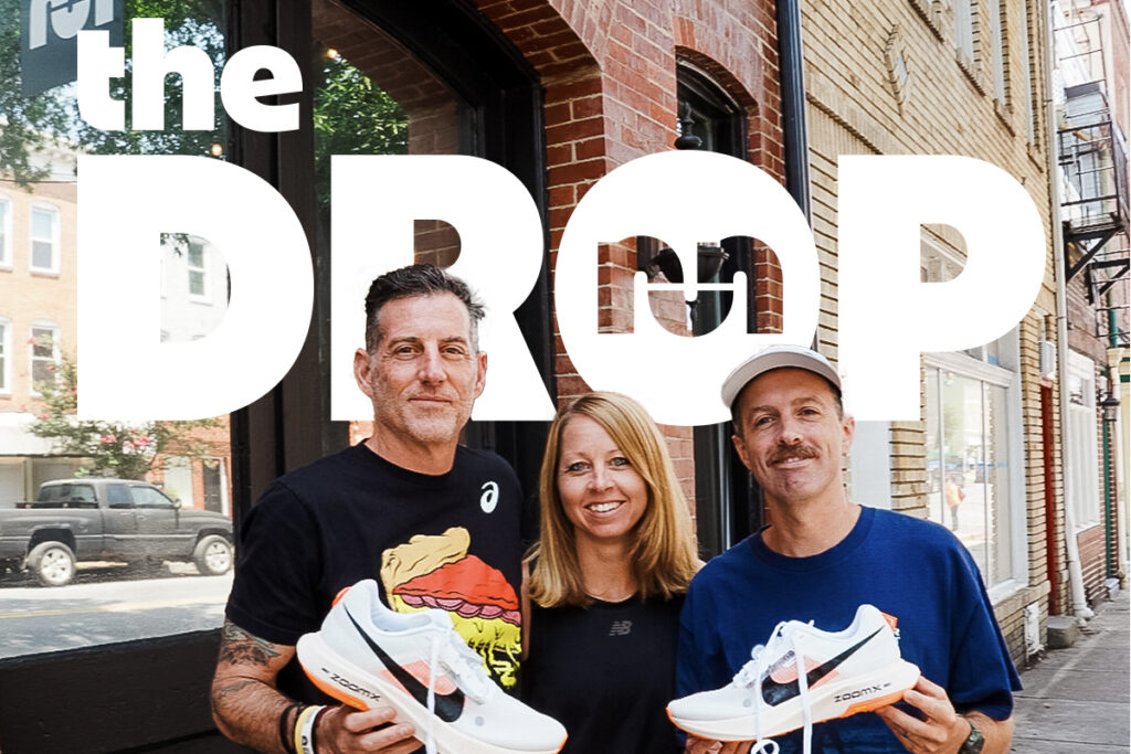 man on left holding white nike shoe, woman in middle, man with mustache on right holding a white nike shoe