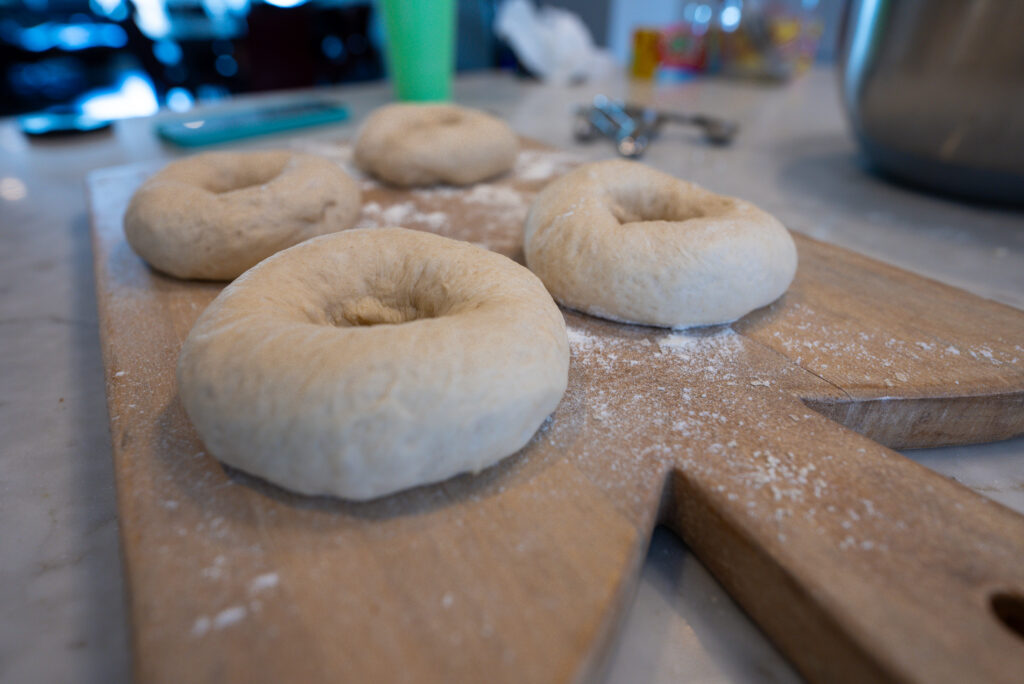 pre-cooked bagels on cutting board