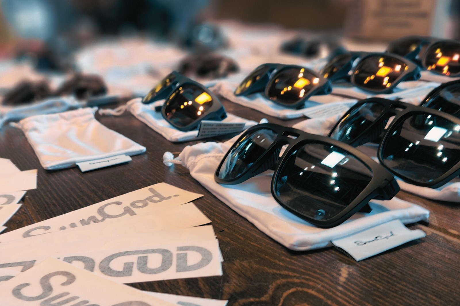 A group of sunglasses on a table.