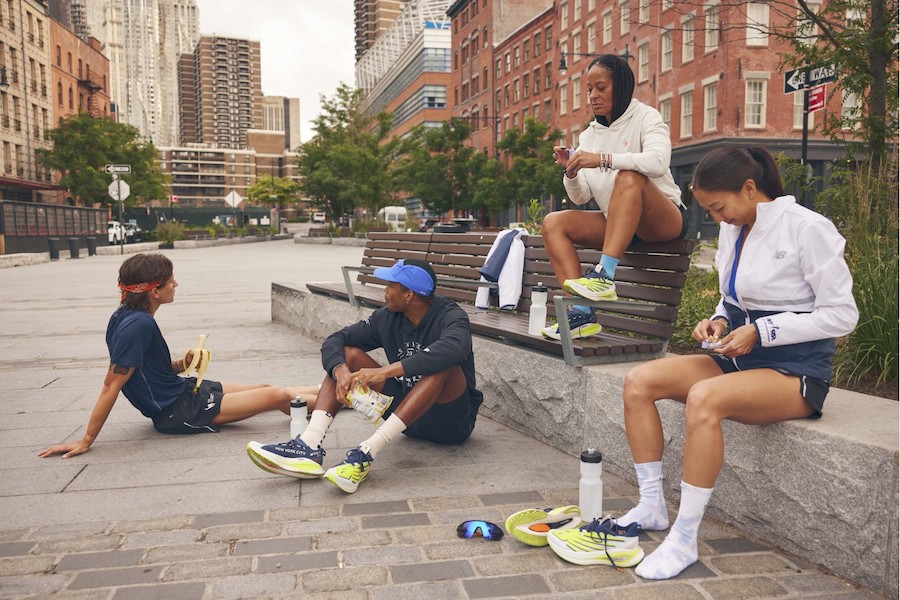 group of runners sitting down in a city