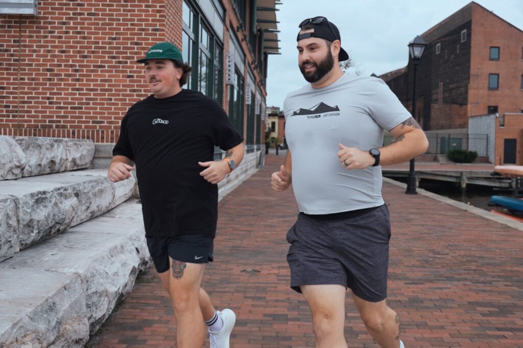 two big guys running in Baltimore