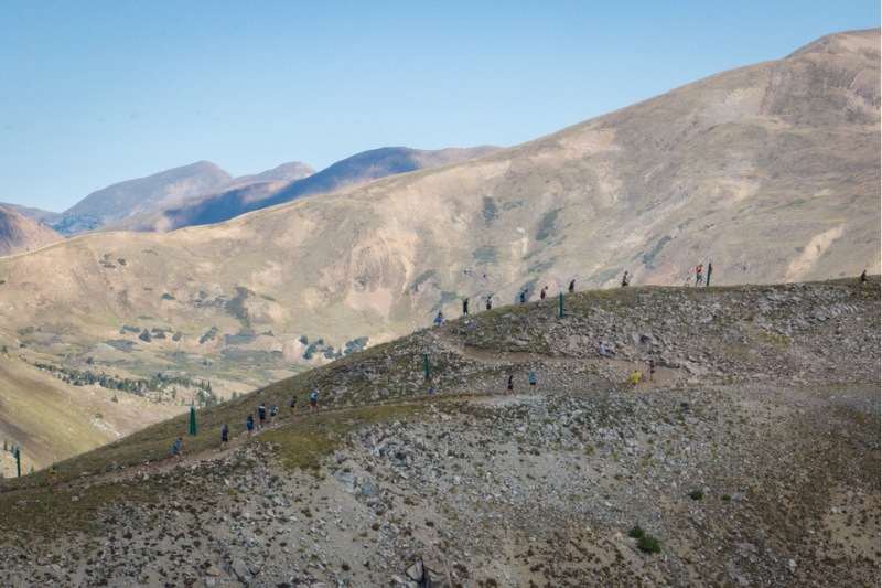 runners on a ridge on a mountain