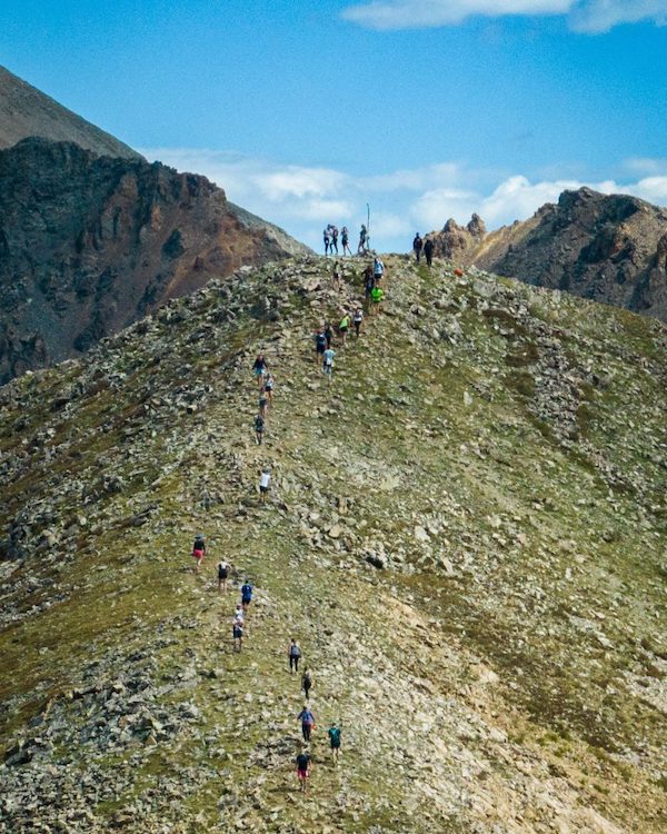 runners going up a mountain
