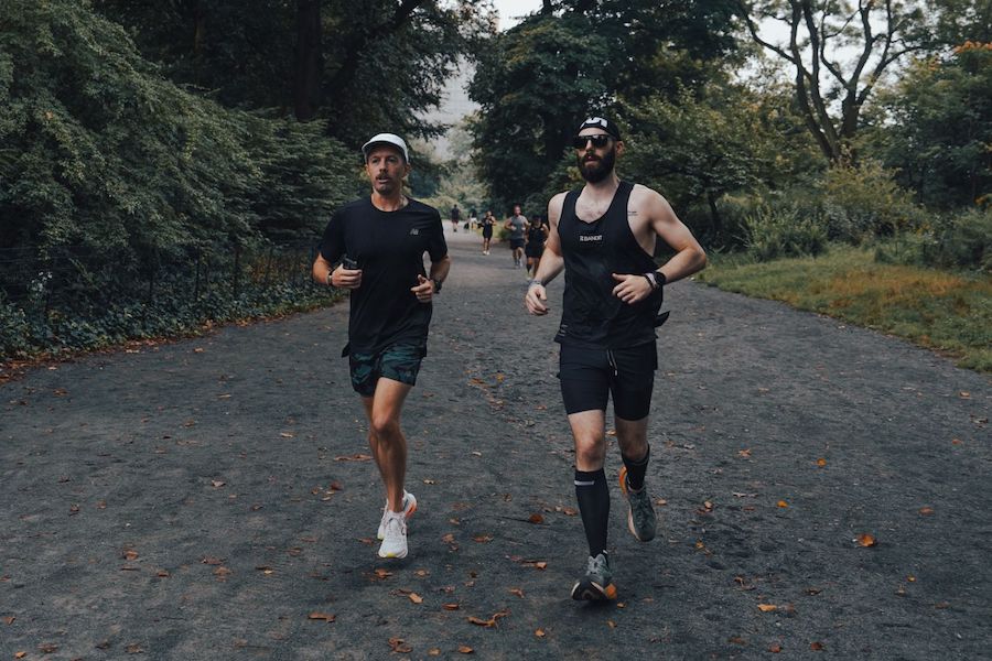 two guys running in central park